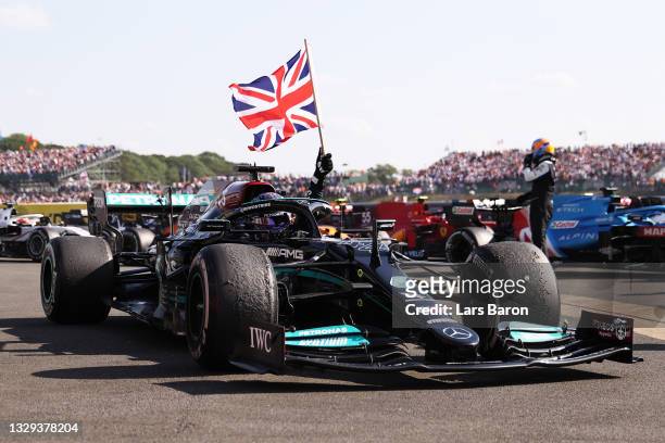 Race winner Lewis Hamilton of Great Britain and Mercedes GP celebrates in parc ferme during the F1 Grand Prix of Great Britain at Silverstone on July...