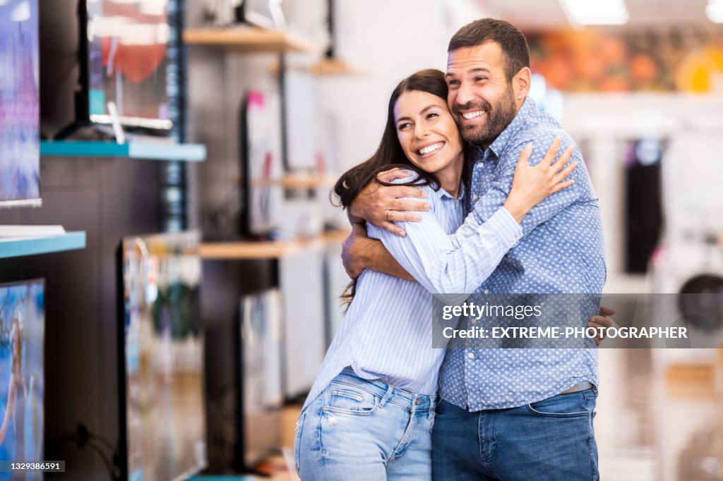 Happy couple enjoys shopping for their new home
