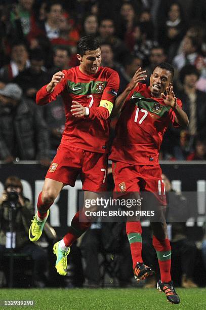 Portugal's forwards Cristiano Ronaldo and "Nani" Cunha celebrate after a goal against Bosnia Herzgovina during their EURO 2012 play-off second leg...