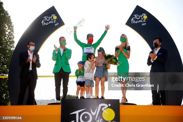 Mark Cavendish of The United Kingdom and Team Deceuninck - Quick-Step Green Points Jersey and his sons Frey David, Delilah Grace & Casper celebrate...