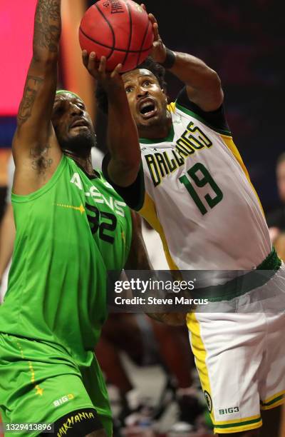 Renaldo Balkman of Aliens defends against Leonardo Barbosa of Ball Hogs during week two of the BIG3 at the Orleans Arena on July 18, 2021 in Las...