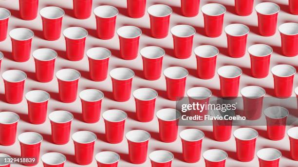 seamless pattern of disposable plastic red cups filling the frame - disposable cup stock pictures, royalty-free photos & images