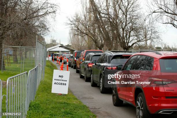 Cars are seen lining up at drive through testing site at Albert Park Lake on July 19, 2021 in Melbourne, Australia. Lockdown restrictions have come...