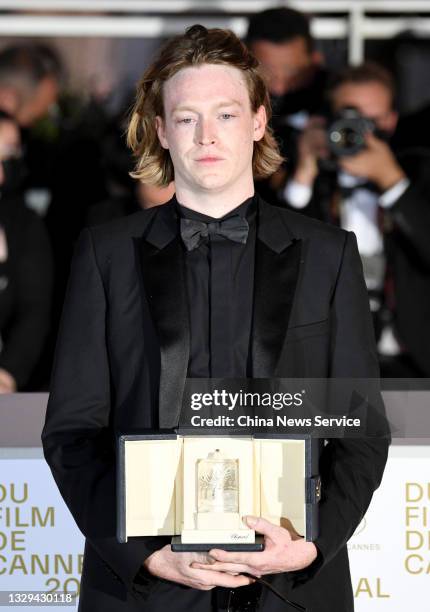Caleb Landry Jones poses with the 'Best Actor Award' for 'Nitram' during the 74th annual Cannes Film Festival on July 17, 2021 in Cannes, France.