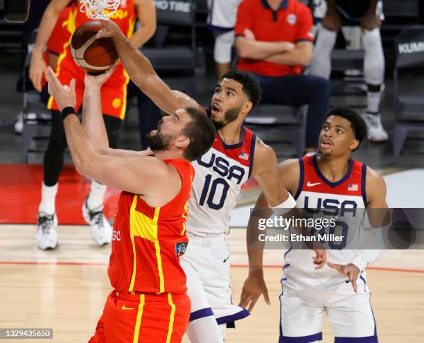 Marc Gasol of Spain is fouled by Jayson Tatum of the United States as Keldon Johnson of the United States defends during an exhibition game at...