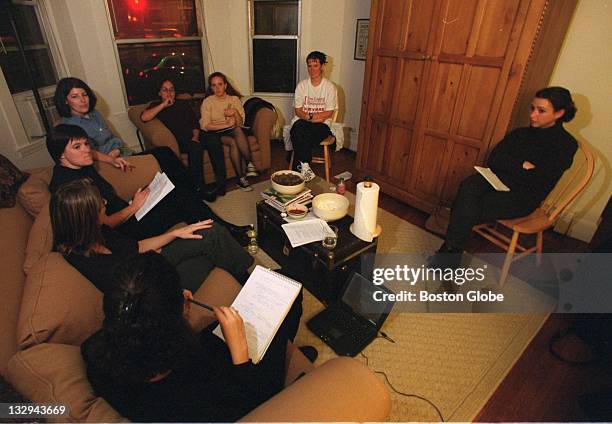 Sarah Feinberg uses her laptop computer to help organize a group meeting with Boston University students that will raise money for social welfare...