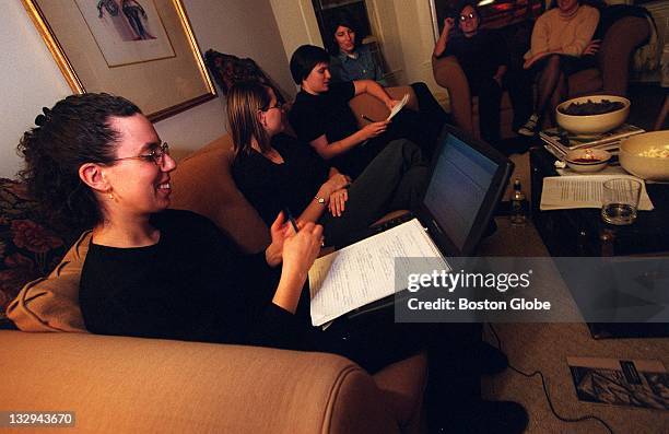 Sarah Feinberg uses her laptop computer to help organize a group meeting with Boston University students that will raise money for social welfare...