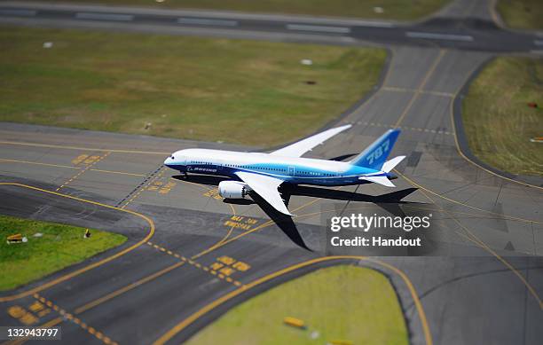 In this handout image provided by Boeing Australia, a Boeing 787 Dreamliner lands at Sydney Airport on November 15, 2011 in Sydney, Australia. The...
