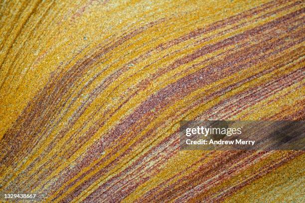 sandstone pattern, layered yellow red stone, close up - sandstone stock pictures, royalty-free photos & images