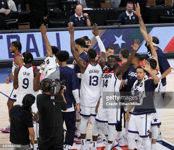 Members of the United States wave to fans after their exhibition game against Spain at Michelob ULTRA Arena ahead of the Tokyo Olympic Games on July...