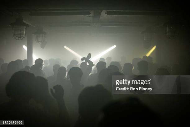 People dancing at Egg London nightclub in the early hours of July 19, 2021 in London, England. As of 12:01 on Monday, July 19, England will drop most...