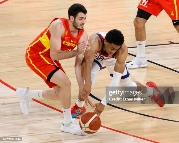 Keldon Johnson of the United States fouls Alex Abrines of Spain as they go after a loose ball during an exhibition game at Michelob ULTRA Arena ahead...