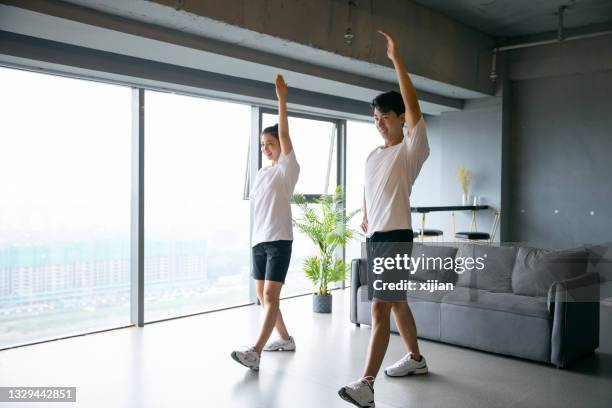 young asian couple exercising together - asian couple exercise stock pictures, royalty-free photos & images