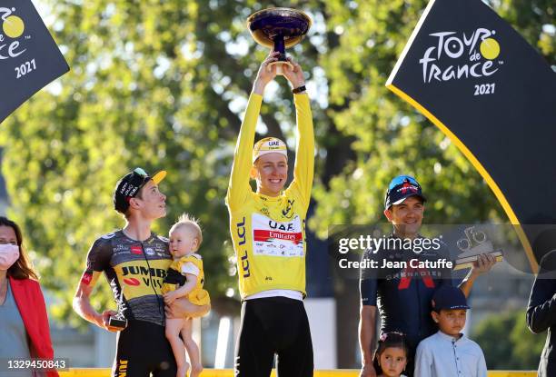 From left, second place of the Tour Jonas Vingegaard of Denmark and Jumbo - Visma , winner's Yellow Jersey Tadej Pogacar of Slovenia and UAE Team...