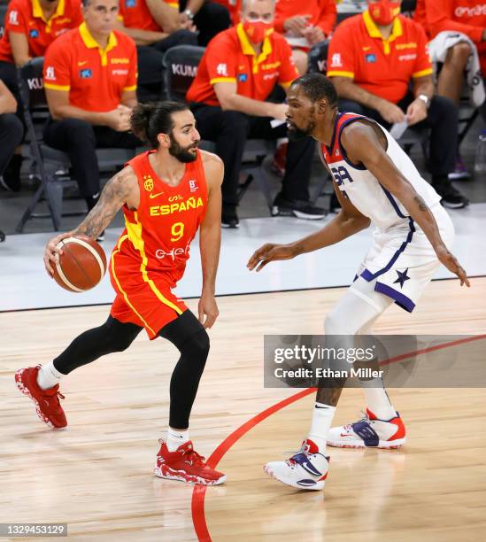Ricky Rubio of Spain looks to pass against Kevin Durant of the United States during an exhibition game at Michelob ULTRA Arena ahead of the Tokyo...