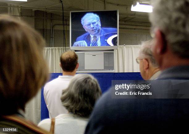 Warren Buffett of Berkshire Hathaway talks to shareholders via closed circuit television May 4, 2002 at the annual Berkshire Hathaway shareholders...