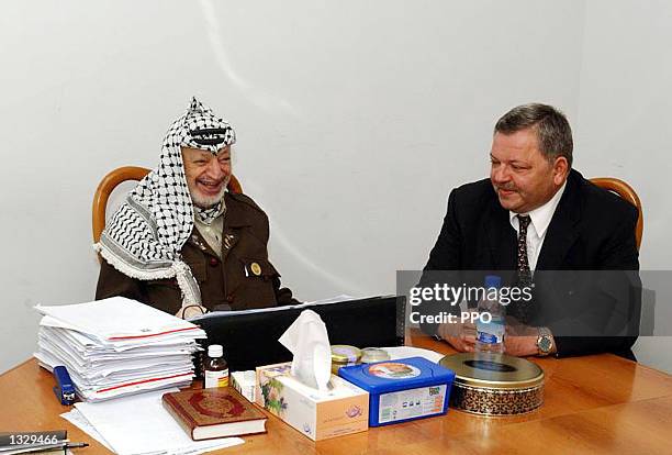 Palestinian leader Yasser Arafat meets with Russian Ambassador Michael Bogdanov May 4, 2002 in Arafat''s West Bank office in Ramallah.