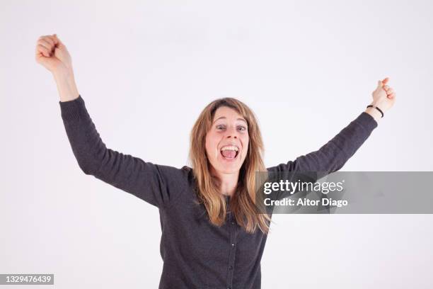 a very happy woman celebrates something. - clapping hands white background stock pictures, royalty-free photos & images