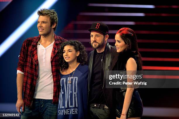 Martin Madeja, Monique Simon, Mirko Bogojevic and Raffaela Wais on stage during 'The X Factor Live' TV-Show on November 15, 2011 in Cologne, Germany.