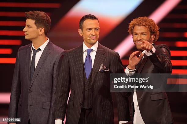 David Pfeffer, Till Broenner and Rufus Martin on stage during 'The X Factor Live' TV-Show on November 15, 2011 in Cologne, Germany.