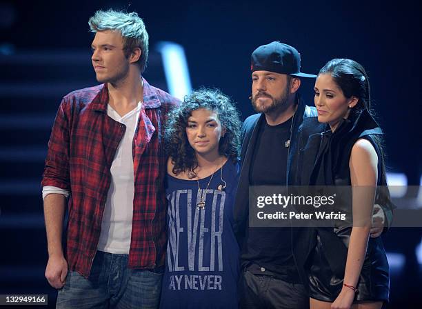 Martin Madeja, Monique Simon, Mirko Bogojevic and Raffaela Wais wait for the votings during 'The X Factor Live' TV-Show on November 15, 2011 in...
