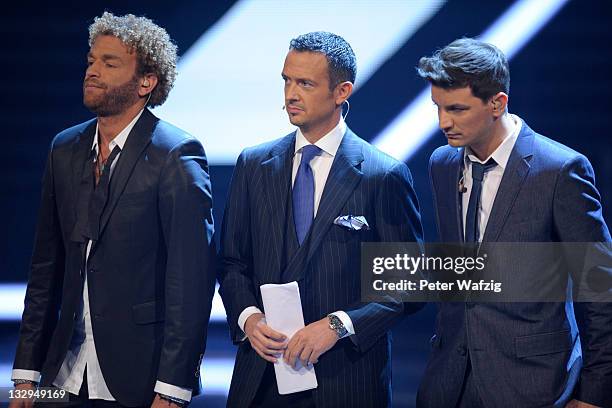 Rufus Martin, Till Broenner and David Pfeffer wait for the votings during 'The X Factor Live' TV-Show on November 15, 2011 in Cologne, Germany.