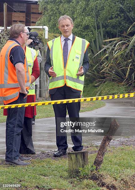 Labour Party leader Phil Goff looks at a section of Gold Kiwifruit vines that were cut out due to PSA disease at the Trevelyan Kiwi Fruit Orchard on...