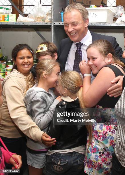 Labour Party leader Phil Goff is mobbed by young volunteers at the Tauranga Food Bank on November 16, 2011 in Tauranga, New Zealand.New Zealanders...