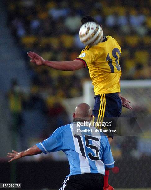 James Rodriguez, from Colombia, fights for the ball with Clemente Rodriguez, from Argentina, during a match between Colombia and Argentina as part of...