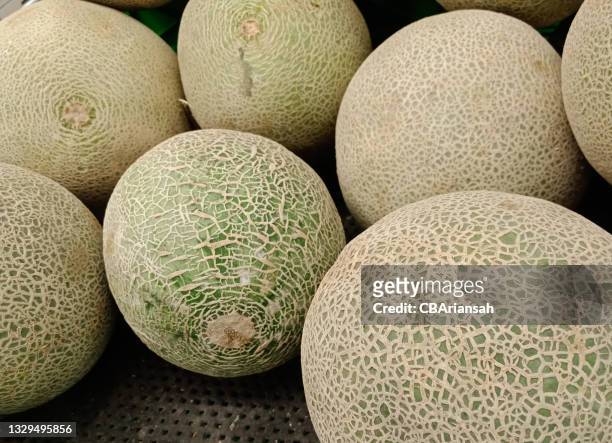 honeydew in the supermarket - honeydew melon stock pictures, royalty-free photos & images