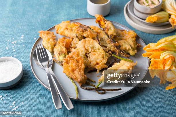 zucchini flowers fried in batter - tempura stock pictures, royalty-free photos & images