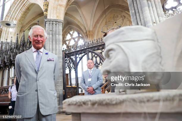 Prince Charles, Prince of Wales observes a gargoyle statue during a visit to Exeter Cathedral on July 19, 2021 in Exeter, United Kingdom. Founded in...