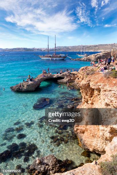 holidays at blue lagoon at the mediterranean sea, malta - malta stock pictures, royalty-free photos & images