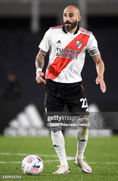 Javier Pinola of River Plate runs with the ball during a match between River Plate and Colon as part of Torneo 2021 of Liga Profesional de Futbol at...