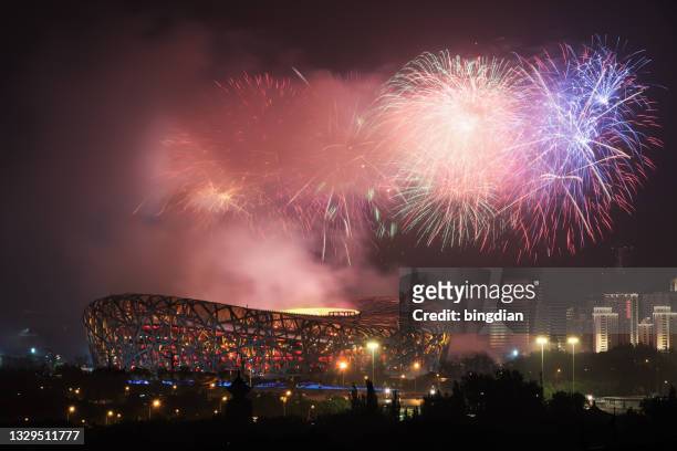 fireworks at beijing national stadium (bird's nest), china - olympic stadium stock pictures, royalty-free photos & images