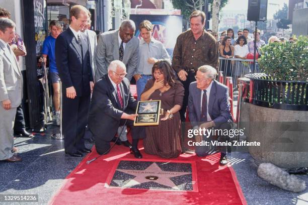 American comedian Roseanne Barr with her son, Jake Pentland, and husband, American actor and comedian Tom Arnold, along with unspecified people, at...