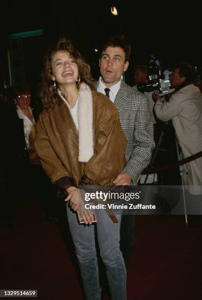 American actress Justine Bateman and her partner, Robert Anderson, attend the Los Angeles premiere of 'Some Kind of Wonderful', held at Mann's...