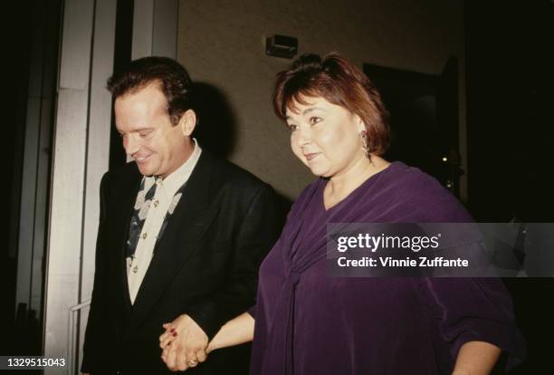 American actor and comedian Tom Arnold and his wife, American comedian Roseanne Arnold, attend a taping of 'Larry King Live' at CNN Studios in Los...