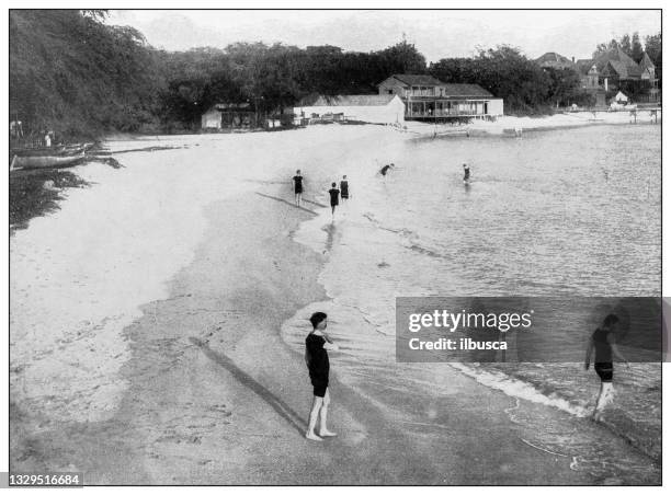 antique black and white photograph: waikiki beach, hawaii - waikiki beach hawaii stock illustrations