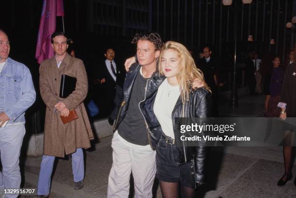 American actor Balthazar Getty, wearing a black leather jacket, and American actress Drew Barrymore, wearing a white t-shirt beneath a black leather...