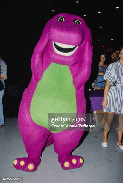 Barney, the purple Tyrannosaurus rex from children's television series 'Barney & Friends', location unspecified, 1993.