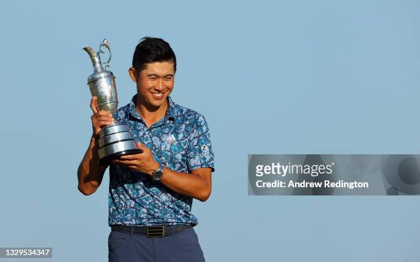 Collin Morikawa of the United States celebrates with the Claret Jug after winning The 149th Open at Royal St George’s Golf Club on July 18, 2021 in...