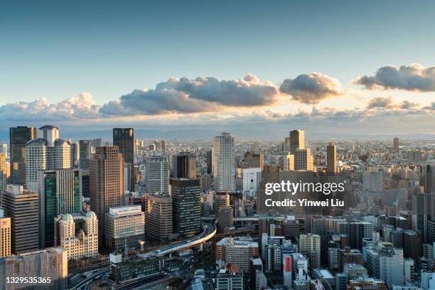 skyscraper of osaka city, view of umeda skyline after sunset - osaka skyline stock-fotos und bilder