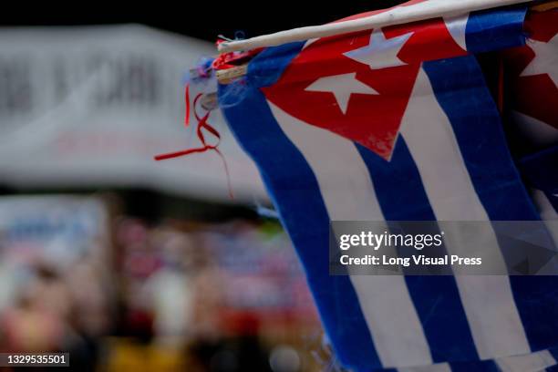 Cuban flags as Cuban residents that live in Colombia protest against the unrest and violence held in the Island against the government of Cuban...