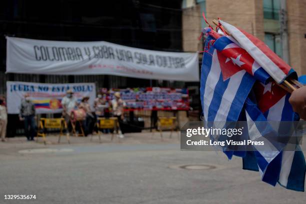 Cuban flags as Cuban residents that live in Colombia protest against the unrest and violence held in the Island against the government of Cuban...