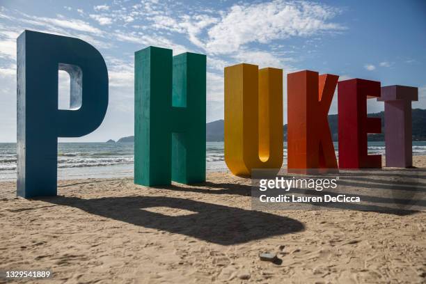 Large "Phuket" sign welcomes "Sandbox" arrivals to Patong Beach, Thailand's most popular beach, on July 19, 2021 in Phuket, Thailand. Travelers visit...