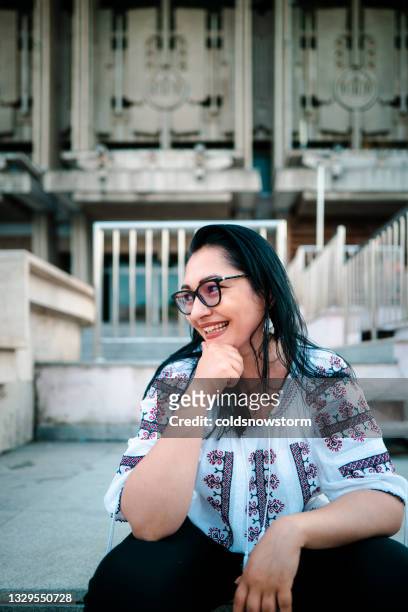 romanian woman wearing traditional clothing outdoors in the city - romania stock pictures, royalty-free photos & images