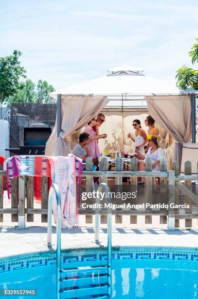 young people eating in the pool - ibiza party stock pictures, royalty-free photos & images