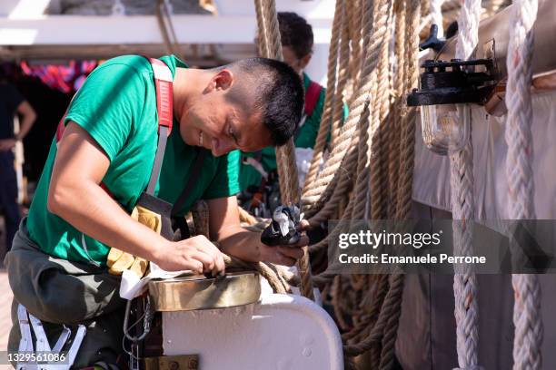 Close-up of one of the Amerigo Vespucci officers at work on the sailing ship moored in the bay of La Maddalena in Sardinia on July 19, 2021 in La...