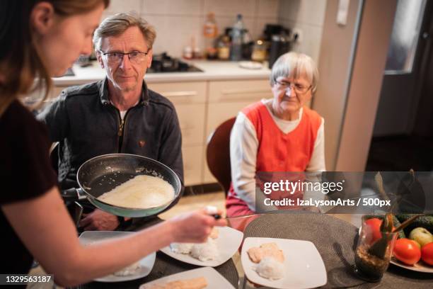 family having breakfast,poland - baby boomer and millennial stock pictures, royalty-free photos & images